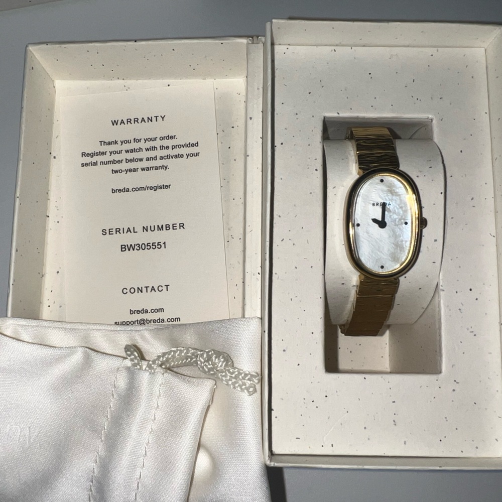 Gold Oval Watch with White Dial